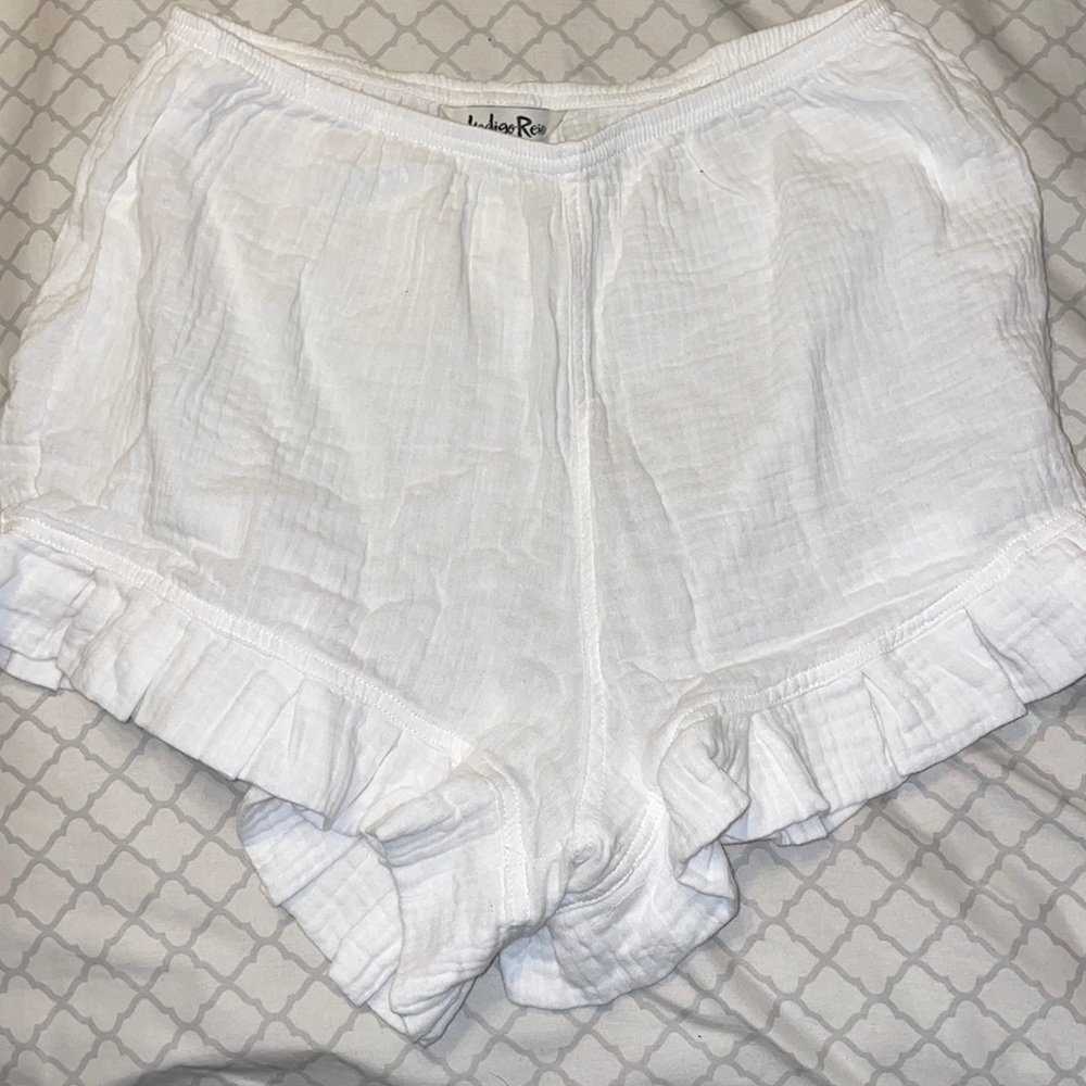 Cute, flowy white shorts. Used as a bathing suit cover up as they are thin